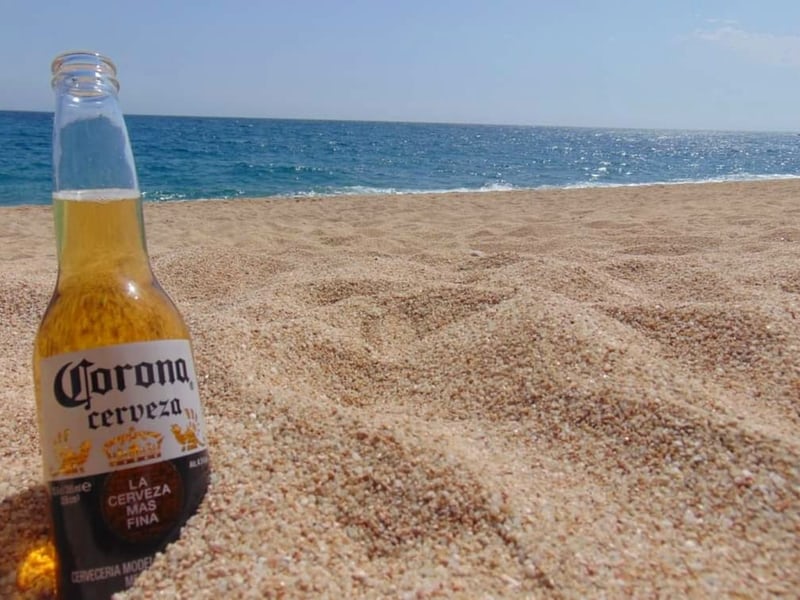 A Bottle Of Corona Beer On The Beach